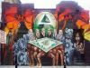 This mural reflects the Reality of elite exploitation and debt oppression placed intentionally on the global population