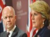 Oz FM Julie Bishop, subservient US puppet, overseen by US official at the Hague