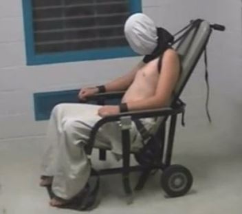 Restrained indigenous Youth, a la US 'enhanced interrogation' style